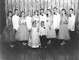 Junior Prom, 1958.  l-r: Grace Zimmerman, Dennis Feller, Anna Marie Marty, John Ponyiscanyi, Carolyn Klassy, Walter Mueller, Mary Klassy, John Holdrich, Judy Gibbons, Thomas Marty.  The little King and Queen are unidentified.